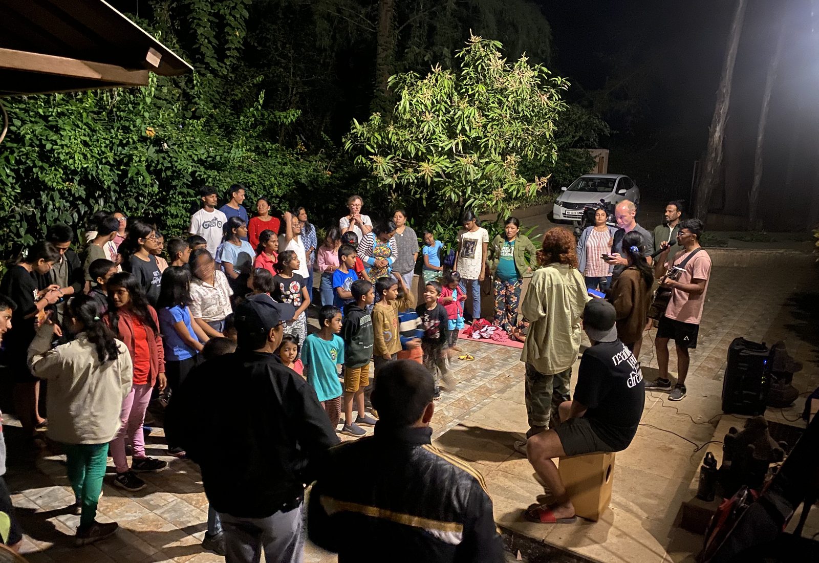 Zechariah ministering in worship and prayer to a gathering of people in India